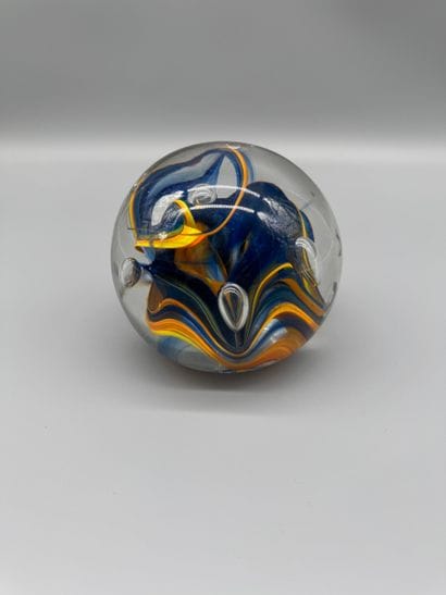 Glass paperweight with an interior design...