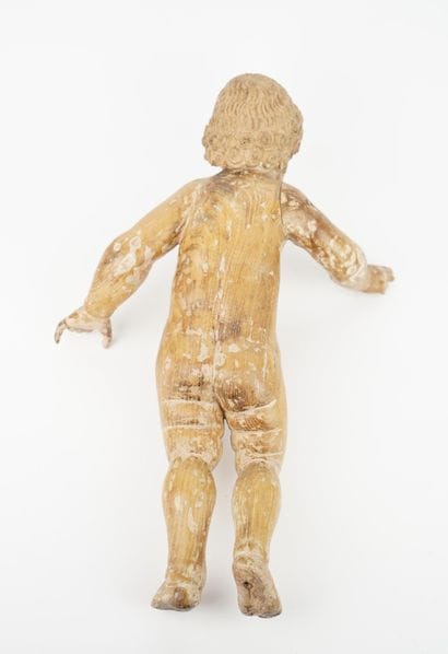 Enfant en bois sculpté, bénissant
Les yeux...