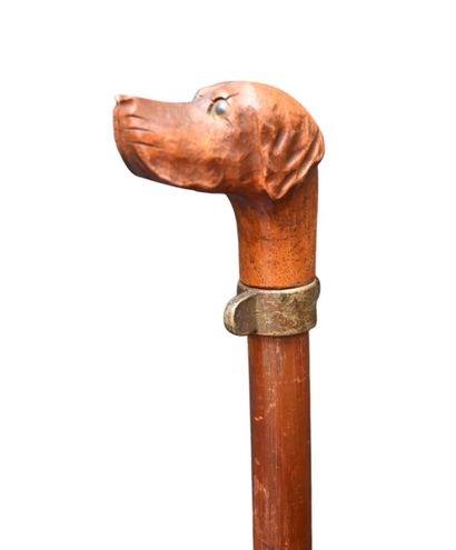 Carved wooden walking stick with dog head...