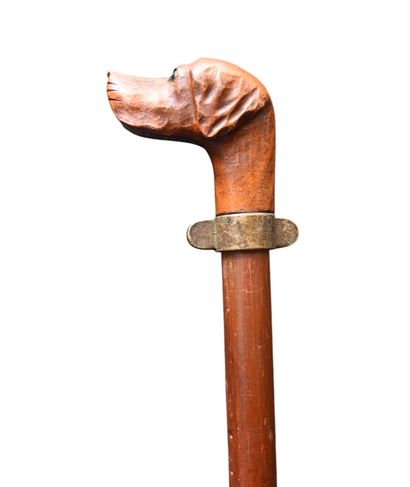 Carved wooden walking stick with dog head...