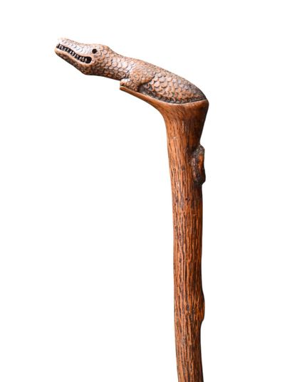 One-piece carved wooden cane with crocodile-shaped...