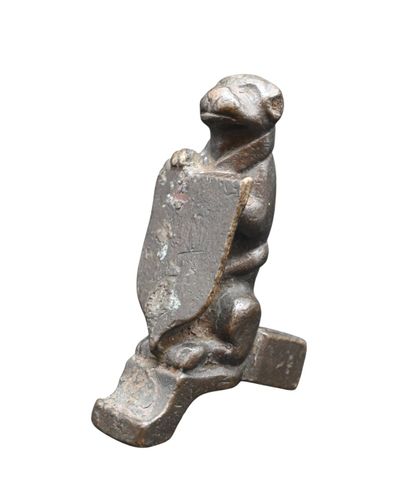 Petite sculpture en bronze – Chien tenant...