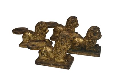 Ensemble de quatre lions en bronze doré,...