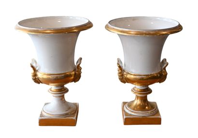 Pair of gilded and white porcelain urn vases,...