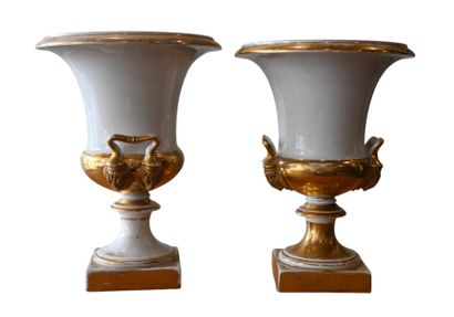 Pair of gilded and white porcelain urn vases,...