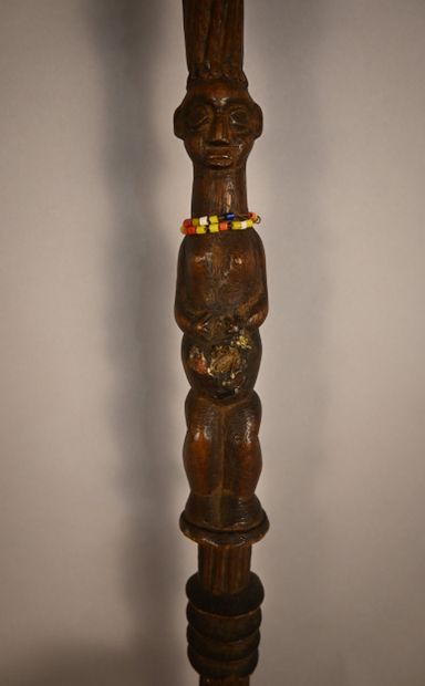 Yaka stick with two carved figures, first...