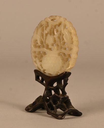 Openwork jade plaque on wooden base, China,...