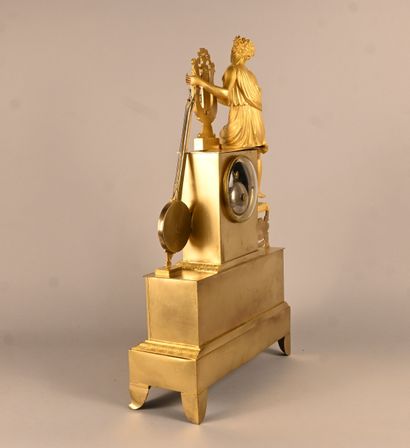 Empire-style gilt bronze clock with musical...