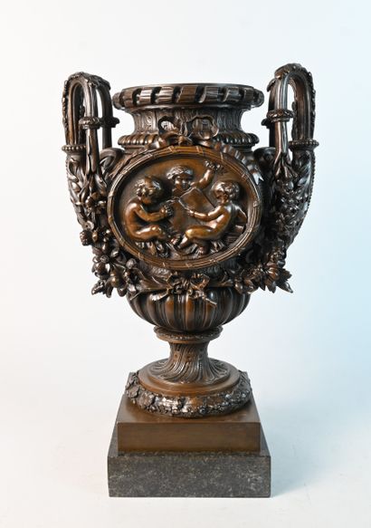 Bronze vase decorated with children and garlands,...