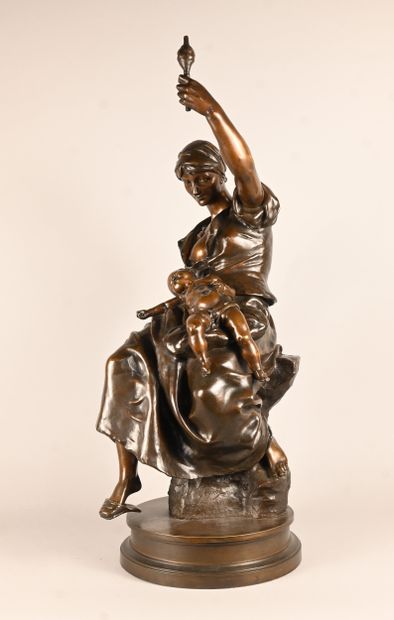 Bronze sculpture of a mother with child,...