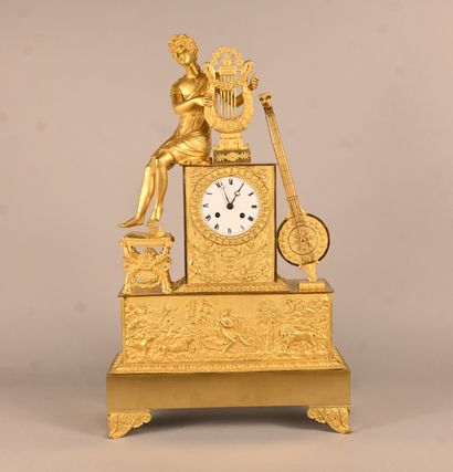 Empire-style gilt bronze clock with musical...