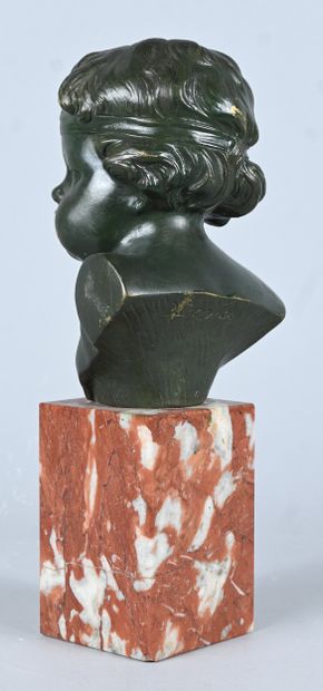 Bust of a child in green patinated bronze,...