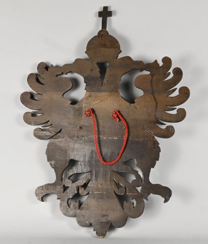 Heraldic shield in carved wood decorated...