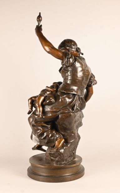 Bronze sculpture of a mother with child,...