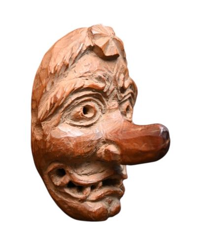 Japanese wooden Netsuke depicting a grotesque...