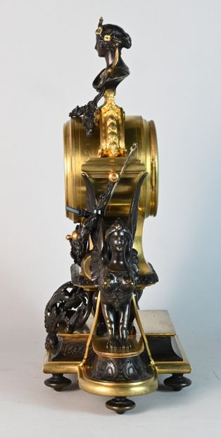 Patinated bronze and gilt bronze clock with...