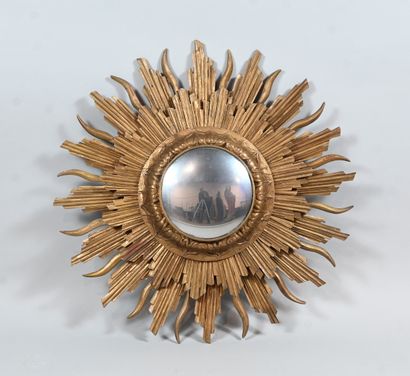 Gilded wood sunburst mirror with convex mirror
An...
