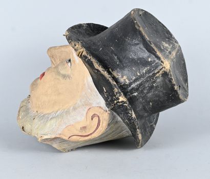 Polychrome papier-mâché mask of a male figure...