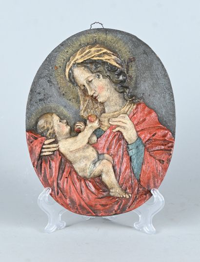 Carved and polychromed wooden wall plaque...