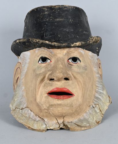Polychrome papier-mâché mask of a male figure...