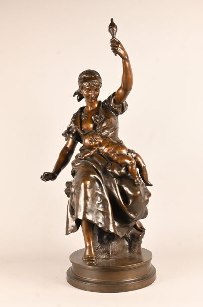 Bronze sculpture of a mother with child,...