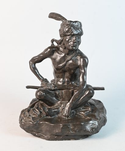 Stoneware sculpture of a seated Native American...