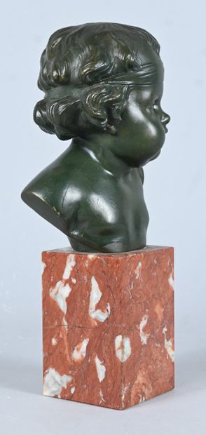 Bust of a child in green patinated bronze,...
