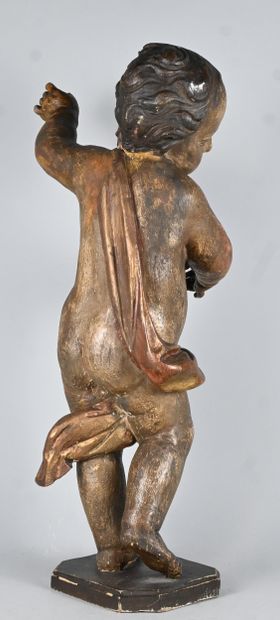 Baroque standing angel in carved and gilded...