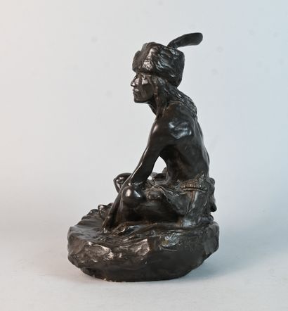 Stoneware sculpture of a seated Native American...