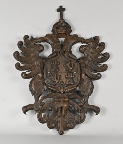 Heraldic shield in carved wood decorated...