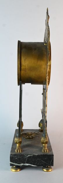 Empire ormolu clock with winged figures on...