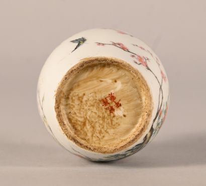 Porcelain snuff bottle decorated with prunus...