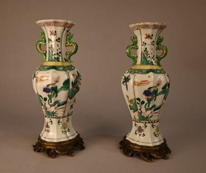 Pair of green family porcelain vases mounted...