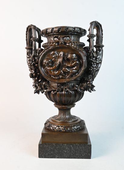 Bronze vase decorated with children and garlands,...