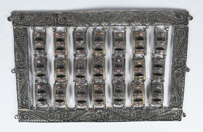 Filigree silver panel with suspended elements...