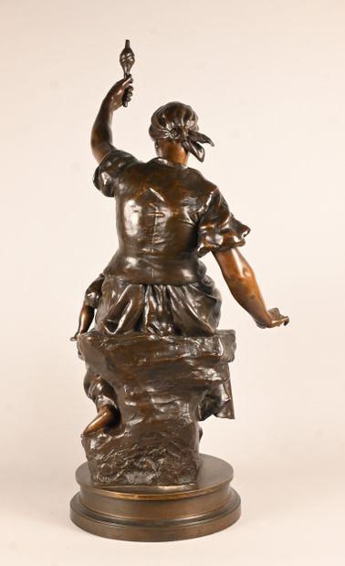 Bronze sculpture of a mother with child,...