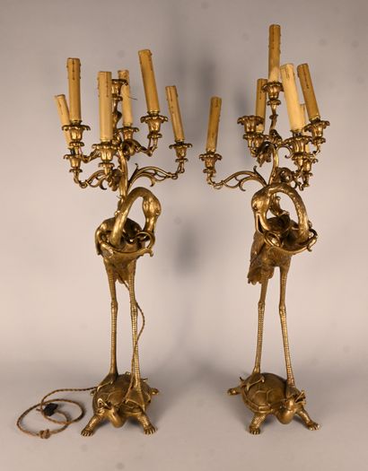 Pair of bronze candelabras with waders and...