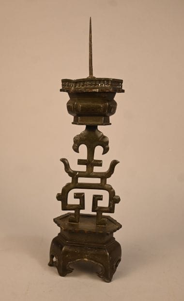 Pewter candlestick with openwork decoration...