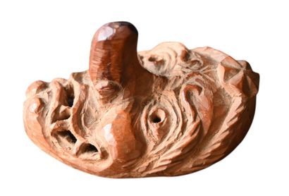 Japanese wooden Netsuke depicting a grotesque...