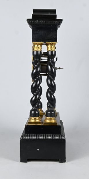 Blackened wood and gilt bronze column clock...