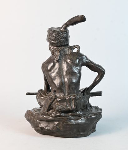 Stoneware sculpture of a seated Native American...