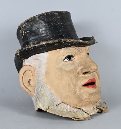 Polychrome papier-mâché mask of a male figure...