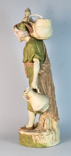 Royal Dux, polychrome porcelain water carrier
Standing...