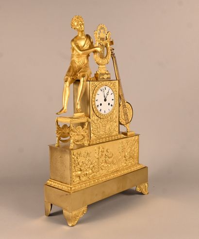 Empire-style gilt bronze clock with musical...