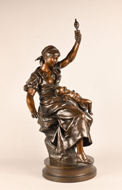 Bronze sculpture of a mother with child,...