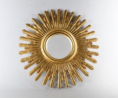 Gilded composite sunburst mirror with curved...