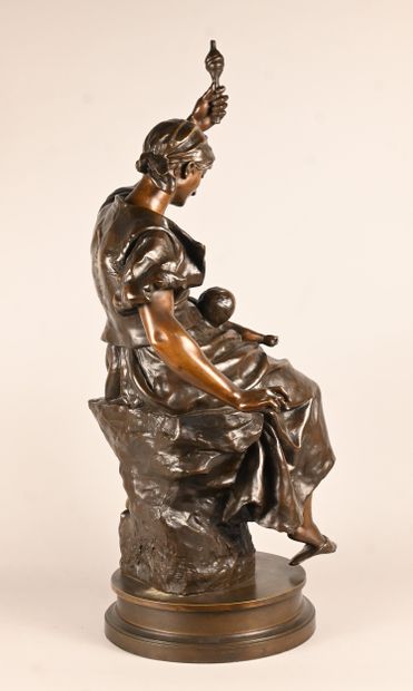 Bronze sculpture of a mother with child,...