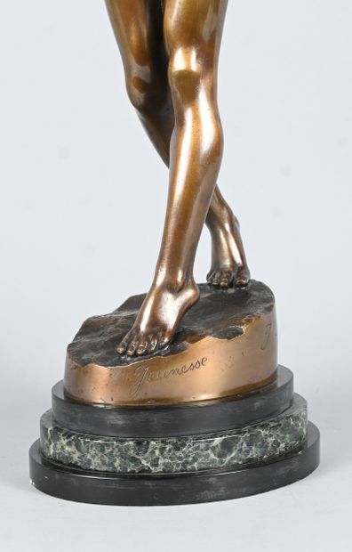 Youth, bronze statue of a nude female figure...