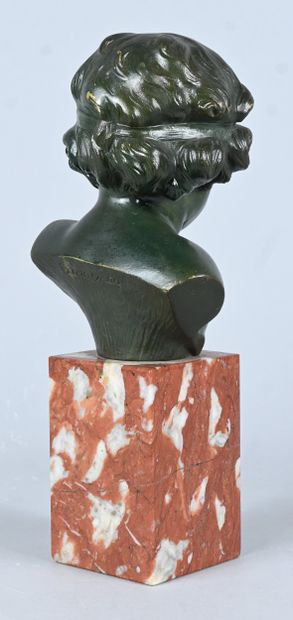 Bust of a child in green patinated bronze,...