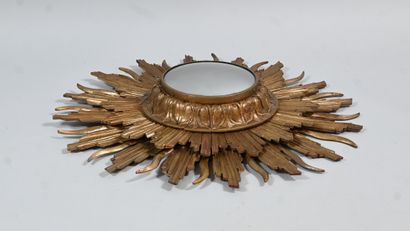 Gilded wood sunburst mirror with convex mirror
An...